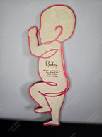 Wooden baby silhouette with engraved text, customizable and handmade in Ontario. Beautiful keepsake or gift for families.