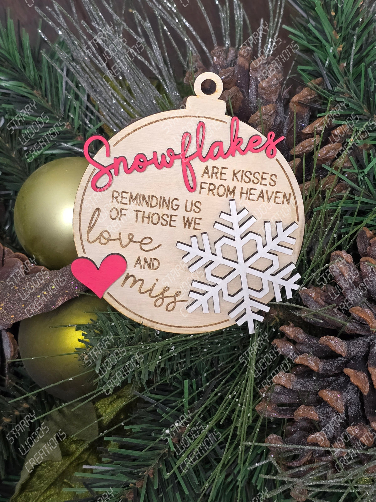Decorative wooden memorial ornament with text and snowflake design on a Christmas tree. Handmade in Quinte west and Customizable.