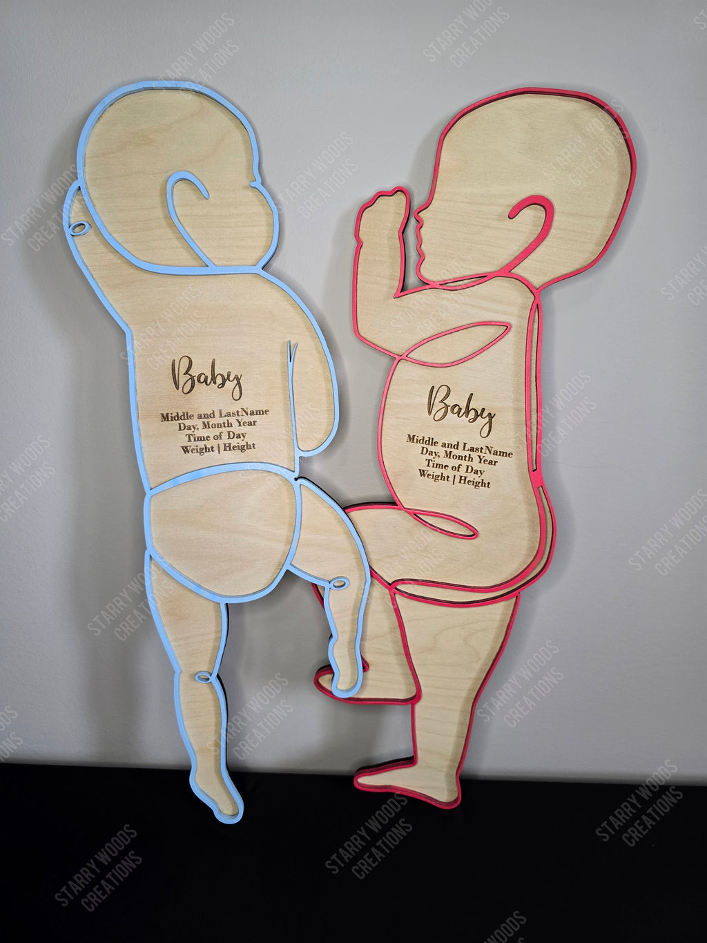 Two wooden baby silhouettes. Coloured line drawing outline with engraving space for baby's birth stats. To be made 1:1 to match baby's height at birth, perfect as a keepsake or gift.